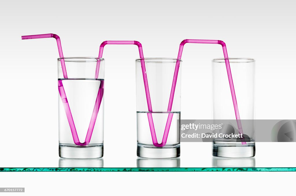 Glasses of water with straws