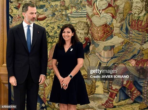 King Felipe VI of Spain poses with mayor of Paris, Anne Hidalgo during their meeting at La Zarzuela Palace in Madrid on April 19, 2017.