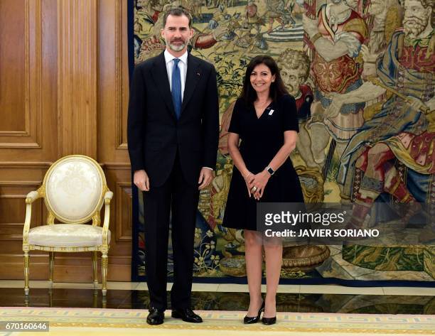 King Felipe VI of Spain poses with mayor of Paris, Anne Hidalgo during their meeting at La Zarzuela Palace in Madrid on April 19, 2017.
