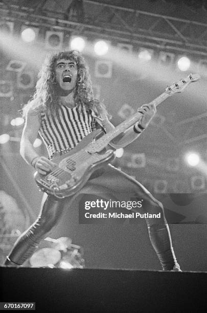 Bassist Steve Harris performing with British heavy metal group, Iron Maiden, at the Reading Festival, 28th August 1982.