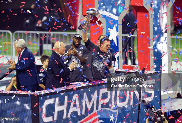 Tom Brady of the New England Patriots raises the Vince Lombardi trophy after the Patriots defeat the Atlanta Falcons 34-28 in overtime of Super Bowl...