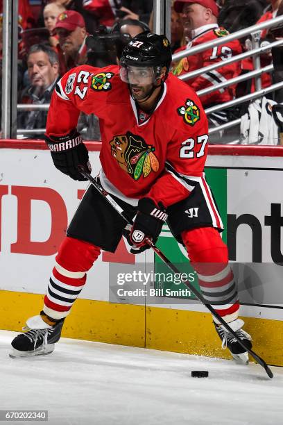 Johnny Oduya of the Chicago Blackhawks takes control of the puck in the second period against the Nashville Predators in Game One of the Western...