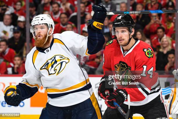 Ryan Ellis of the Nashville Predators and Richard Panik of the Chicago Blackhawks watch for the puck in the third period in Game One of the Western...