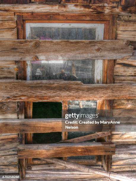 old boarded up cabin window - boarded up stock pictures, royalty-free photos & images