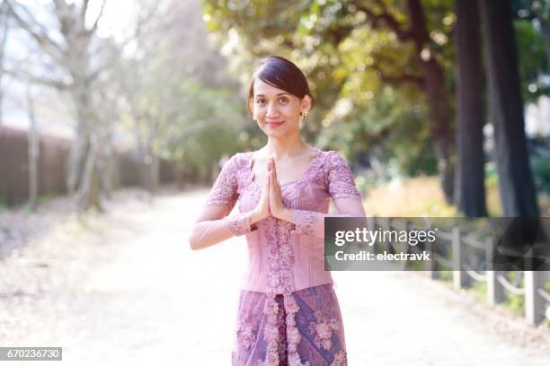 woman in indonesian dress - batik indonesia stockfoto's en -beelden