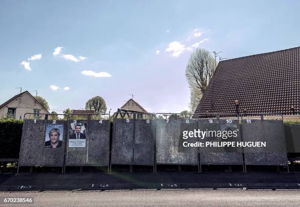 Election posters showing French presidential election candidate for the far-right Front National party Marine Le Pen and French presidential election...