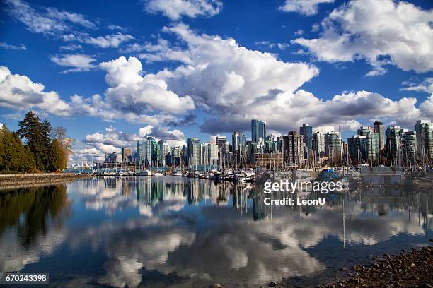 vancouver skyline reflection, canada - vancouver skyline stock pictures, royalty-free photos & images