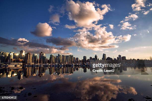 vancouver skyline sunset reflection, canada - vancouver sunset stock pictures, royalty-free photos & images