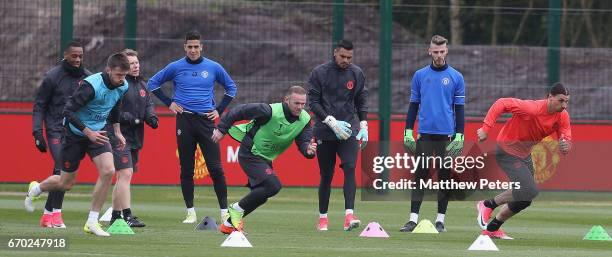 Michael Carrick, Wayne Rooney and Zlatan Ibrahimovic of Manchester United in action during a first team training session at Aon Training Complex on...