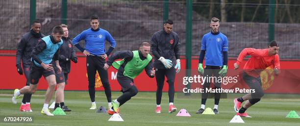 Michael Carrick, Wayne Rooney and Zlatan Ibrahimovic of Manchester United in action during a first team training session at Aon Training Complex on...