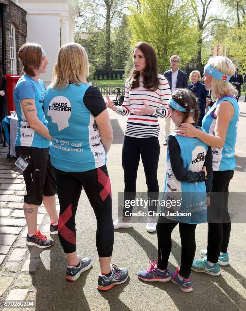 Catherine, Duchess of Cambridge speaks with runners from Team Heads Together ahead of the 2017 Virgin Money London Marathon, at Kensington Palace on...