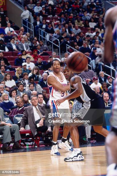 Allen Iverson of the Philadelphia 76ers passes against the San Antonio Spurs circa 1998 at the Spectrum in Philadelphia, Pennsylvania. NOTE TO USER:...