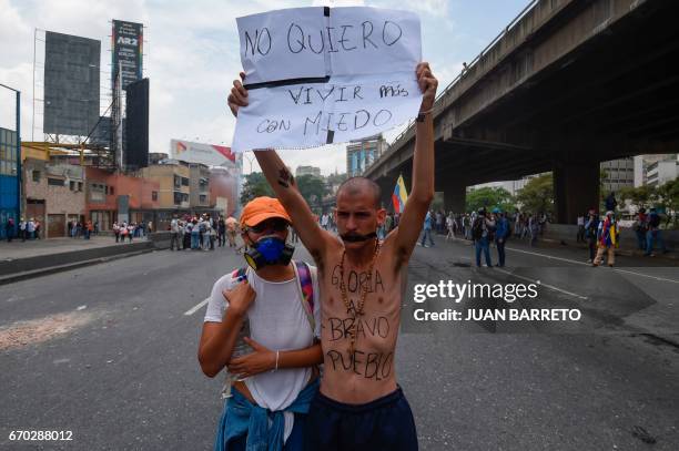 Man holds a poster reading "I don't want to live in fear anymore" during a rally against Venezuelan President Nicolas Maduro, in Caracas on April 19,...