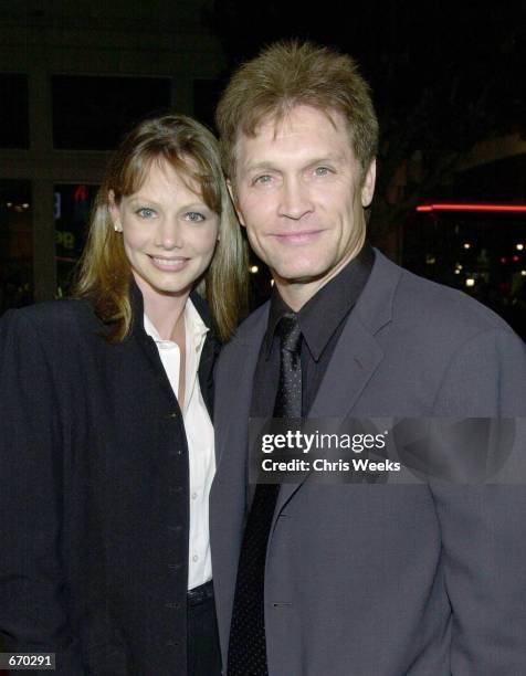 Actor Andrew Stevens and wife Robyn pose for photographers while arriving at the premiere of Warner Bros.'' "Get Carter" October 4, 2000 in Westwood,...