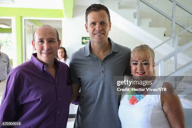 Oliver Bierhoff, team manager of the German national team, pose with Luis Ramirez and Alejandra Bustamante of Icatech during the visit and unveiling...