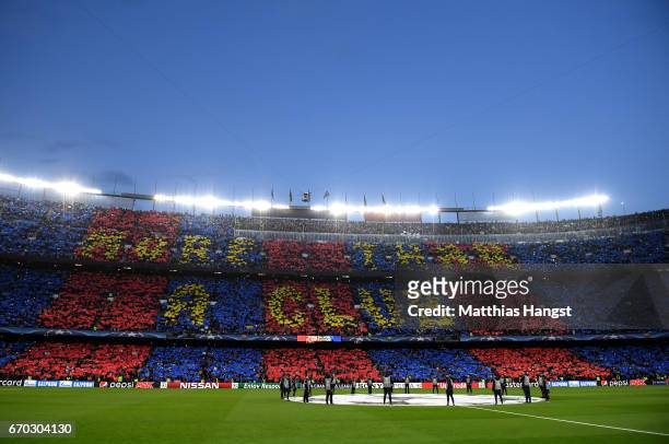 General view inside the stadium as fans create a display with cards prior to the UEFA Champions League Quarter Final second leg match between FC...
