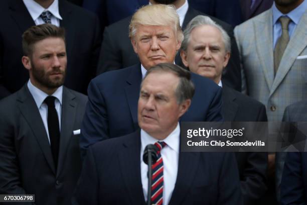 President Donald Trump listens to New England Patriots Head Coach Bill Belichick deliver remarks during an event celebrating the team's Super Bowl...