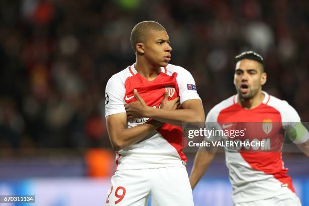 Monaco's French forward Kylian Mbappe Lottin and Monaco's Colombian forward Radamel Falcao celebrate after Mbappe opened the scoring during the UEFA...