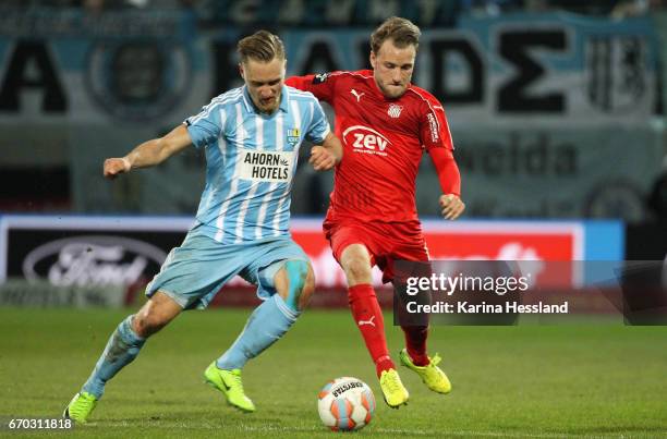 Bjoern Jopek of Chemnitz challenges Mike Koennecke of Zwickau during the Semi-finals at Wernesgruener Sachsen Pokal between Chemnitzer FC and FSV...