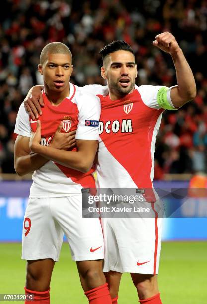 Kylian Mbappe of AS Monaco celebrates his goal with captain Radamel Falcao during the UEFA Champions League Quarter Final second leg between AS...