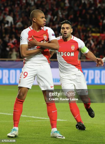 Kylian Mbappe of AS Monaco celebrates his goal with captain Radamel Falcao during the UEFA Champions League Quarter Final second leg between AS...