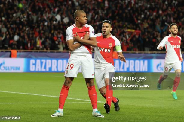 Kylian Mbappe of AS Monaco celebrates his goal with captain Radamel Falcao during the UEFA Champions League Quarter Final second leg between AS...