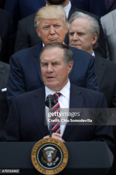 President Donald Trump listens to New England Patriots Head Coach Bill Belichick deliver remarks during an event celebrating the team's Super Bowl...