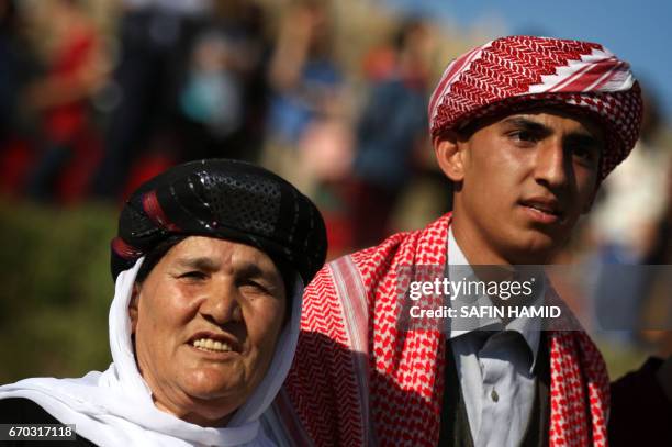 Iraqis Yazidis dance during a ceremony celebrating the Yazidi New Year on April 19 in the town of Bashiqa, some 20 kilometres north east of Mosul.