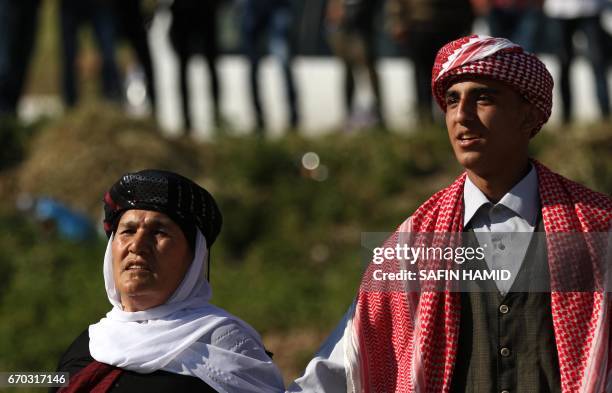 Iraqis Yazidis dance during a ceremony celebrating the Yazidi New Year on April 19 in the town of Bashiqa, some 20 kilometres north east of Mosul.