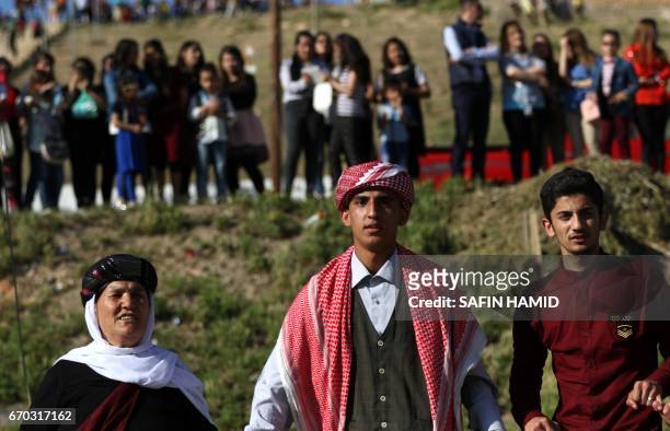 Iraqis Yazidis dance during a ceremony celebrating the Yazidi New Year on April 19 in the town of Bashiqa, some 20 kilometres north east of Mosul.