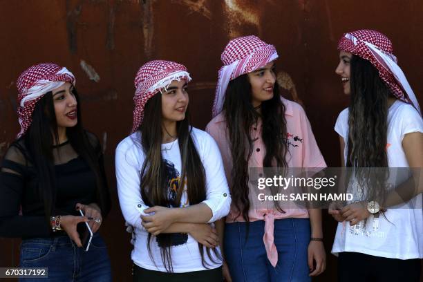 Iraqi Christian girls attend a ceremony celebrating the Yazidi New Year on April 19 in the town of Bashiqa, some 20 kilometres north east of Mosul.