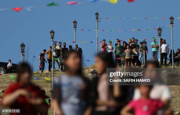 Iraqis attend a ceremony celebrating the Yazidi New Year on April 19 in the town of Bashiqa, some 20 kilometres north east of Mosul.