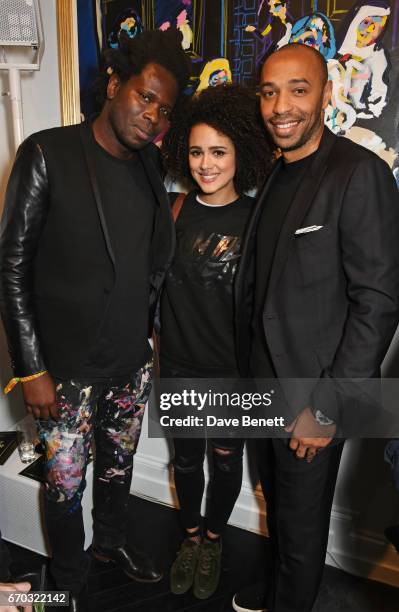 Bradley Theodore, Nathalie Emmanuel and Thierry Henry attend a VIP private view for New York artist Bradley Theodore at Maddox Gallery on April 19,...