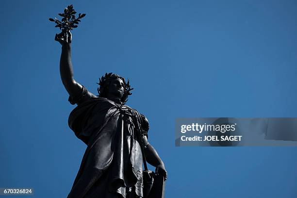 Picture taken on April 19, 2017 shows the statue of Marianne at the Place de la Republique in Paris.