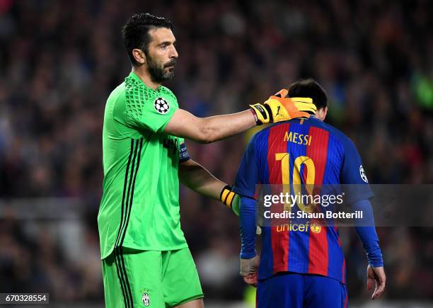 Gianluigi Buffon ofJuventus pats Lionel Messi of Barcelona on the back during the UEFA Champions League Quarter Final second leg match between FC...