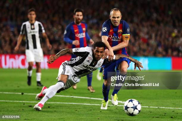 Dani Alves of Juventus tangles with Andres Iniesta of FC Barcelona during the UEFA Champions League Quarter Final second leg match between FC...