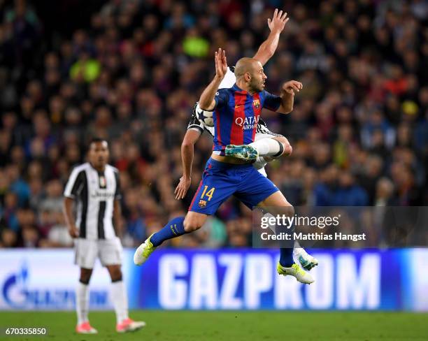 Gonzalo Higuain of Juventus and Javier Mascherano of Barcelona battle for possession during the UEFA Champions League Quarter Final second leg match...