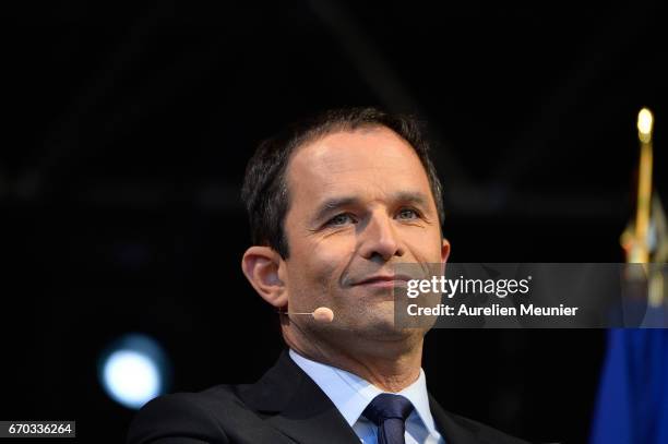 French Socialist Party Presidential candidate Benoit Hamon addresses voters during a political meeting Place de la Republique on April 19, 2017 in...