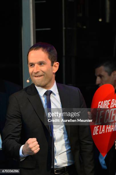 French Socialist Party Presidential candidate Benoit Hamon salutes the crowd as he arrives for a political meeting Place de la Republique on April...