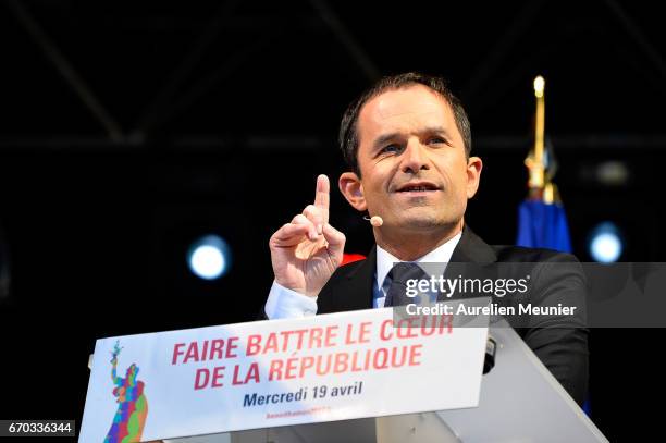 French Socialist Party Presidential candidate Benoit Hamon addresses voters during a political meeting Place de la Republique on April 19, 2017 in...