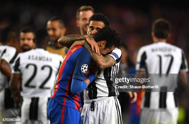 Neymar of Barcelona is embraced by Dani Alves of Juventus during the UEFA Champions League Quarter Final second leg match between FC Barcelona and...