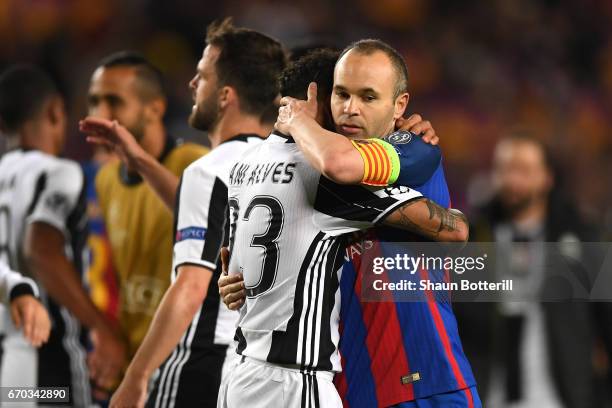 Dani Alves of Juventus and Andres Iniesta of Barcelona embrace after the UEFA Champions League Quarter Final second leg match between FC Barcelona...