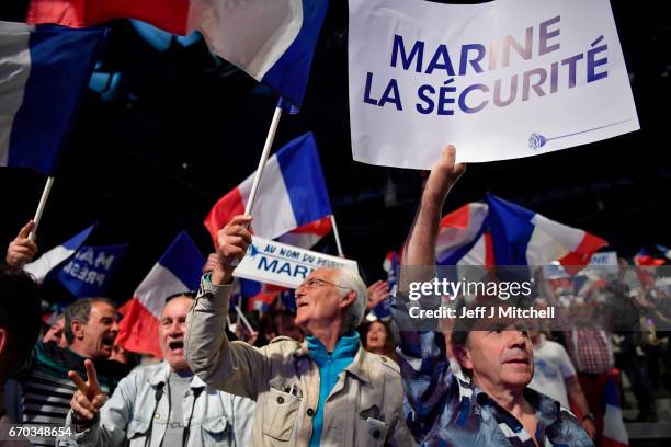 Far right supporters attend a presidential campaign rally by National Front Leader Marine Le Pen at the Dome De Marseille on April 19, 2017 in...