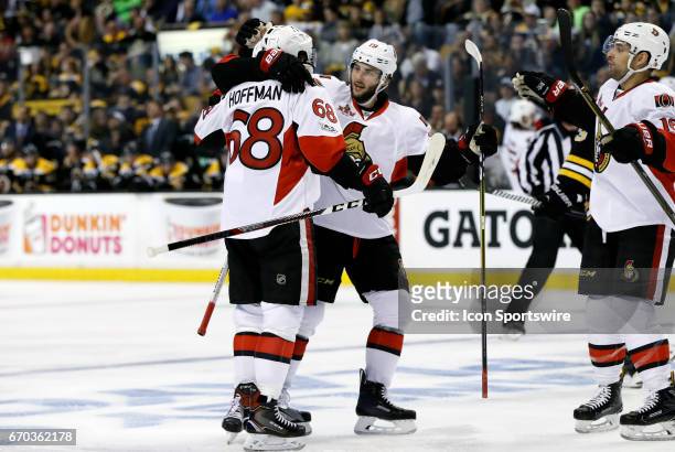 Ottawa Senators center Derick Brassard congratulates Ottawa Senators left wing Mike Hoffman on his second goal of the game during Game 3 of a first...