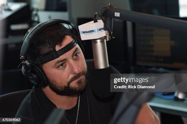 Singer/Songwriter Tyler Farr visits with SiriusXM's The Highway hosted by Storme Warren at SiriusXM Music City Studios on April 19, 2017 in...