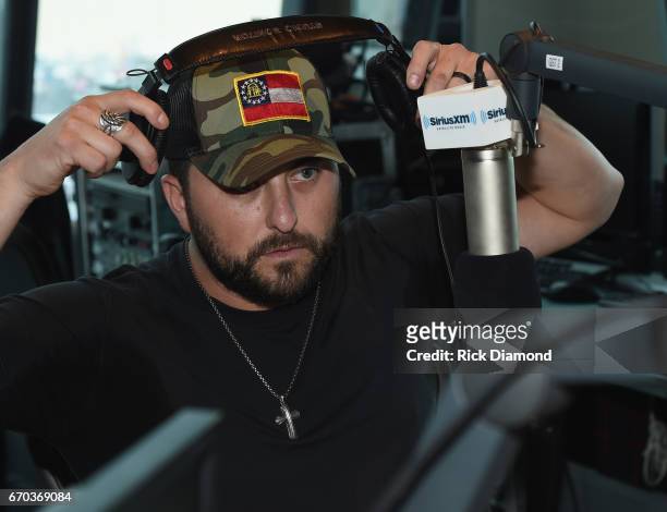 Singer/Songwriter Tyler Farr visits with SiriusXM's The Highway hosted by Storme Warren at SiriusXM Music City Studios on April 19, 2017 in...