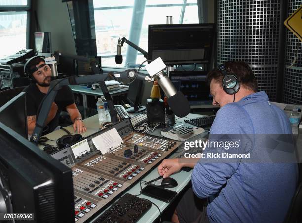 Singer/Songwriter Tyler Farr visits with Storme Warren during SiriusXM The Highway at SiriusXM Music City Studios on April 19, 2017 in Nashville,...