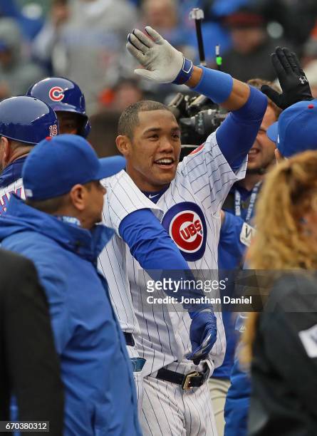 Addison Russell of the Chicago Cubs celebrates after hitting a three run, walk-off home run in the bottom of the 9th inning against the Milwaukee...