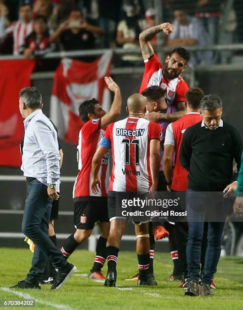 Javier Fabian Toledo of Estudiantes celebrates with teammates after socring the opening goal during a group stage match between Estudiantes and...