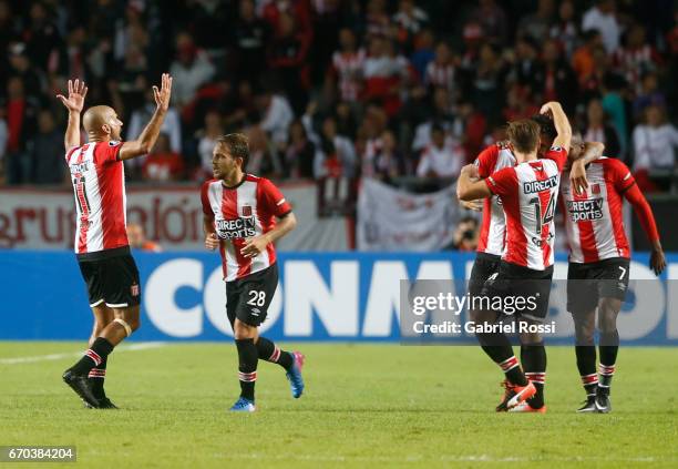 Javier Fabian Toledo of Estudiantes celebrates with teammates after scoring the opening goal during a group stage match between Estudiantes and...